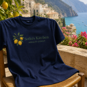Navy unisex t-shirt with Sofia's Kitchen lemon branch graphic on an Amalfi terrace