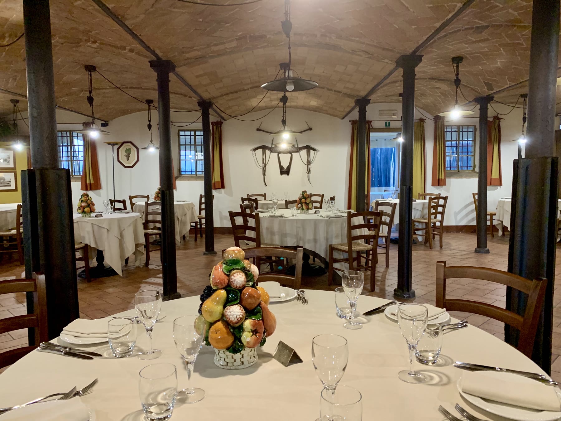 Italian agriturismo romance farm buildings with working-stay honesty and guest climate still named