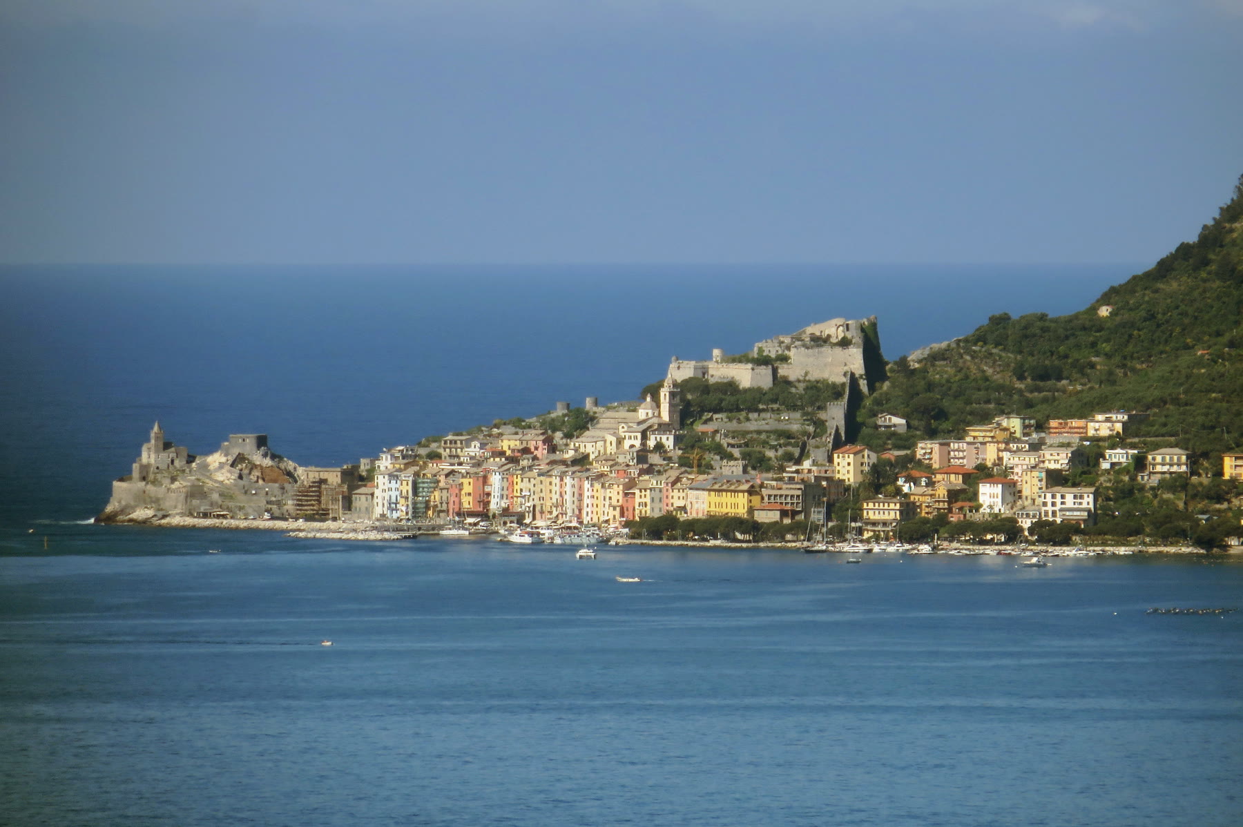 Italian fishing village romance Portovenere harbor pattern with civic boats and adult attention still named