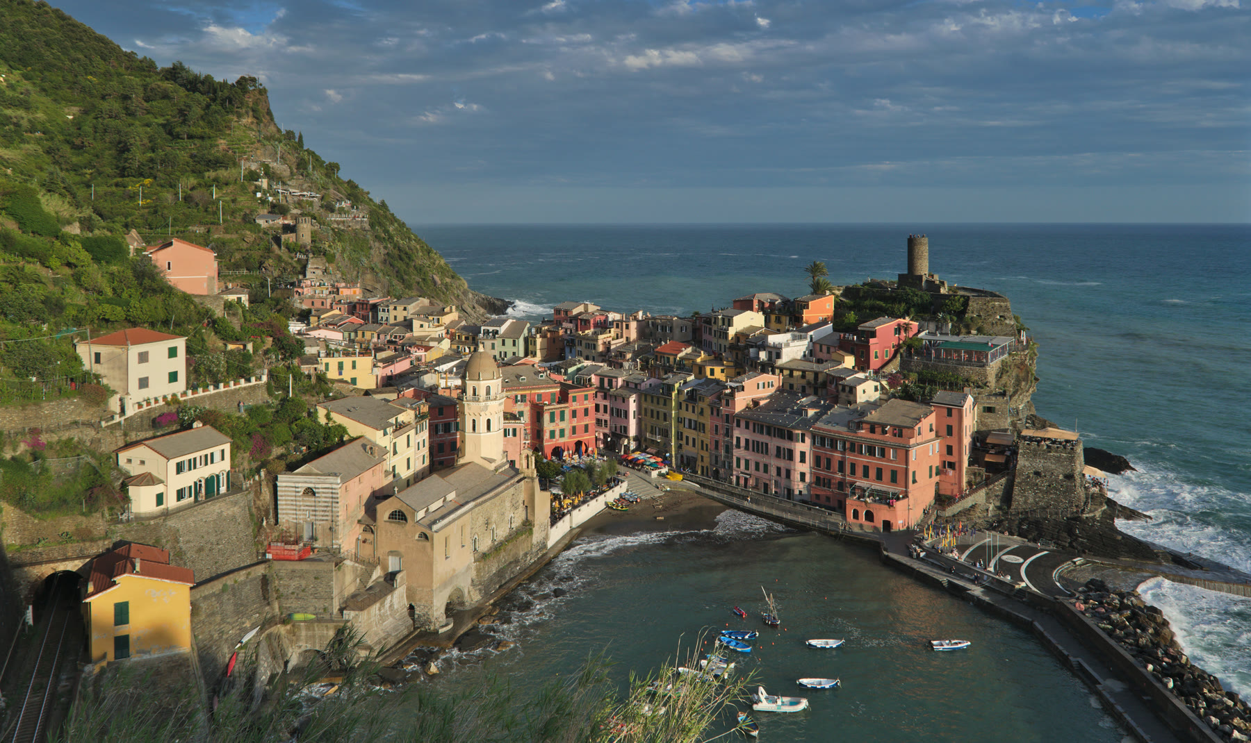 Italian fishing village romance with Vernazza harbor pattern and working boats still named