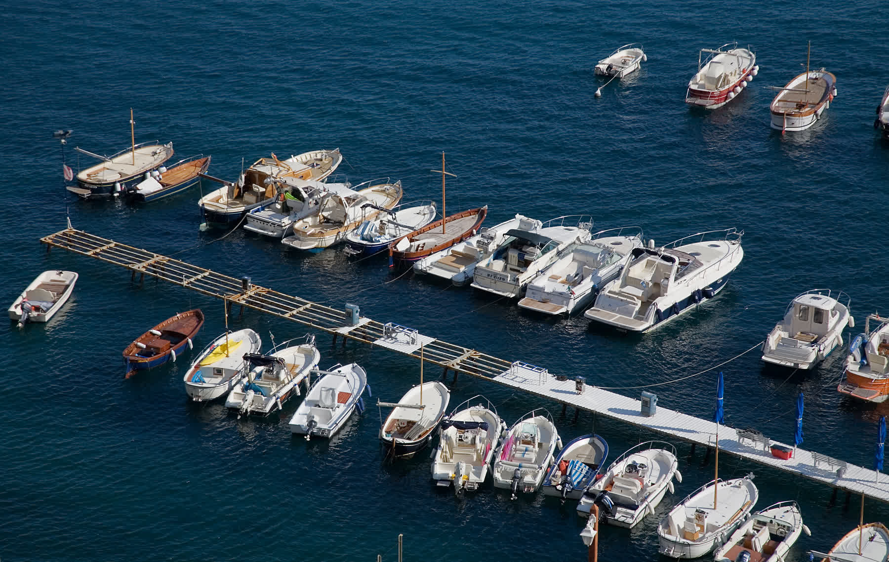 Amalfi harbor under hard light for later in life romance that keeps civic Italy and adult history in the frame
