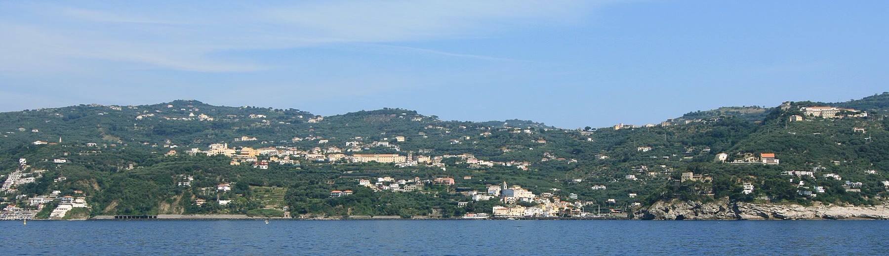 Massa Lubrense from the sea for romance readers with peninsula-ridge climate still named