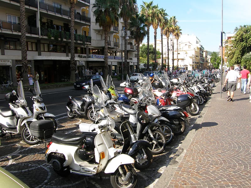 Morning in Sorrento street climate for romance readers with scooters and early civic hours still named
