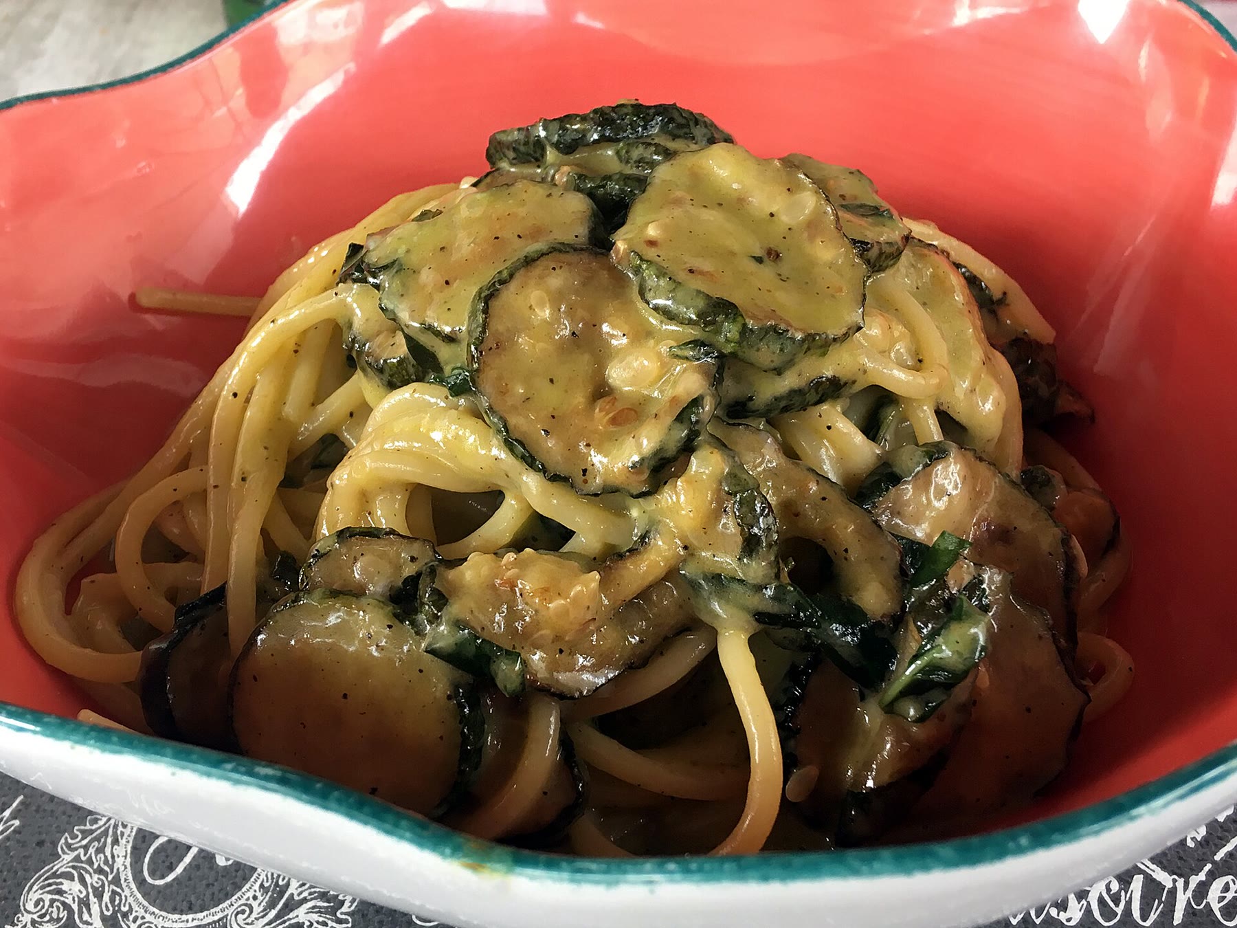Pasta alla Nerano plate for romance readers that keeps zucchini cheese labor beside adult appetite